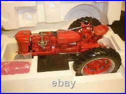 A Franklin mint of a scale model of a International farmall model H, tractor