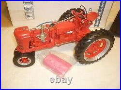 A Franklin mint of a scale model of a International farmall model H, tractor