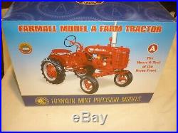 A Franklin mint of a scale model of a International model A farm tractor