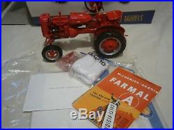A Franklin mint of a scale model of a International model A farm tractor