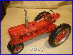 Franklin mint of a scale model of a 1941 McCormick Farmall tractor. 1/12 scale
