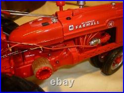 Franklin mint of a scale model of a 1941 McCormick Farmall tractor. 1/12 scale