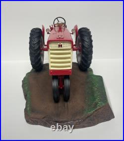 International Harvester Farmall 560 Tractor with Sculpted Base and Plaque