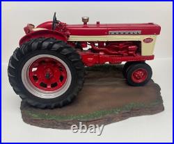 International Harvester Farmall 560 Tractor with Sculpted Base and Plaque