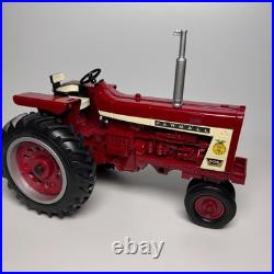 This is an International Harvester Farmall 806 tractor model