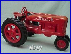 Vintage 1950 International Farmall plastic toy tractor with plastic wagon