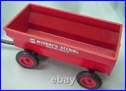Vintage 1950 International Farmall plastic toy tractor with plastic wagon