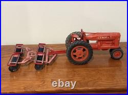 Vintage IH International Harvester Farmall M Tractor 116 with Disc Plow