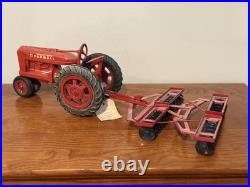 Vintage IH International Harvester Farmall M Tractor 116 with Disc Plow